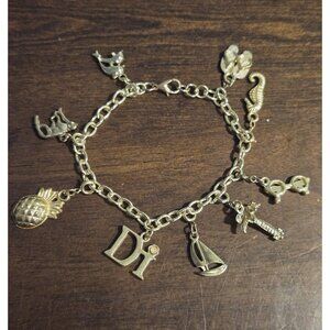 Diamond International Gold Tone Nautical/ Vacation Charm Bracelet